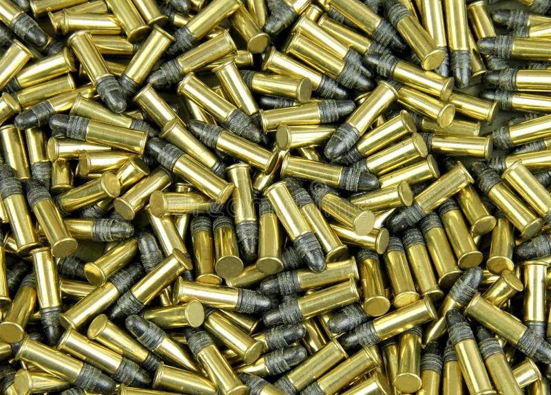 Several Brass cased bullets make a bullet background. Several Brass cased bullets make a bullet background