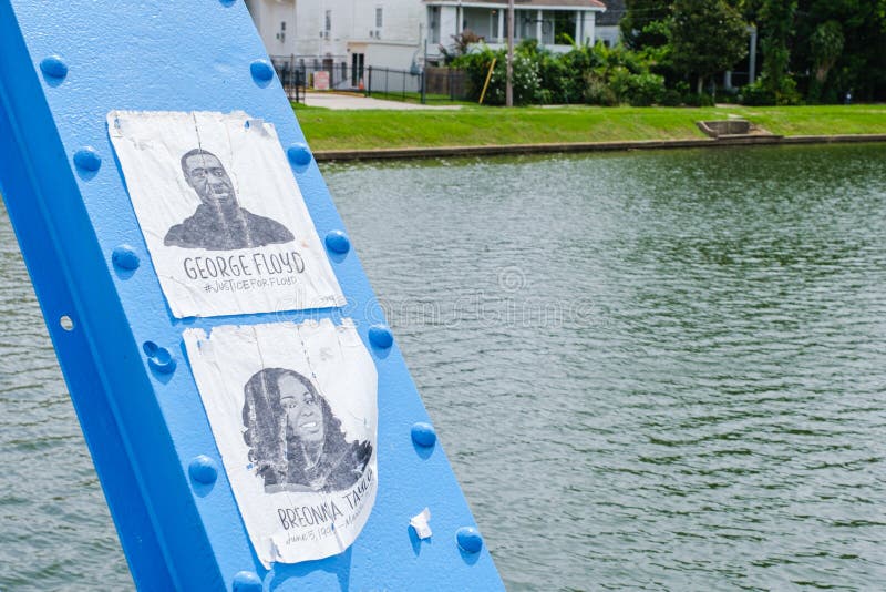 New Orleans, LA/USA - 6/27/2020: Magnolia Bridge over Bayou St. John with images of George Floyd and Breonna Taylor on span. New Orleans, LA/USA - 6/27/2020: Magnolia Bridge over Bayou St. John with images of George Floyd and Breonna Taylor on span