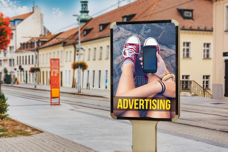 Billboards with advertising of a teenage girl with cellphone. At