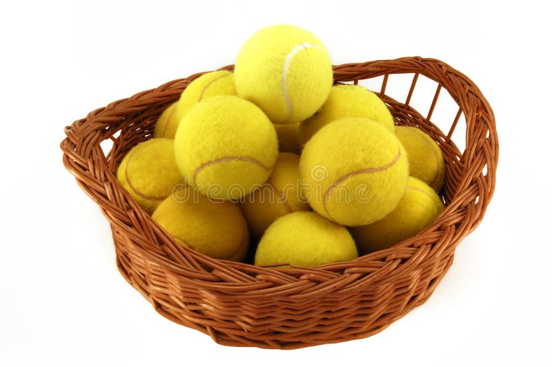 Lot of tennis balls in the basket isolated on white. Lot of tennis balls in the basket isolated on white.