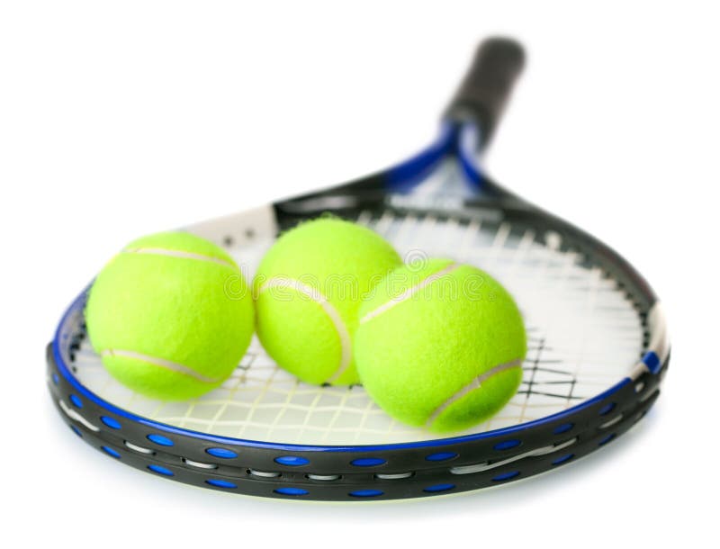 Billes de tennis sur la raquette photographie stock Billes de tennis sur la raquette photographie stock