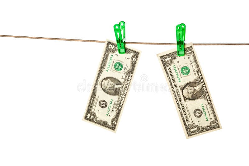 Billets d'un dollar goupillés à une corde à linge image libre de droits Billets d'un dollar goupillés à une corde à linge image libre de droits
