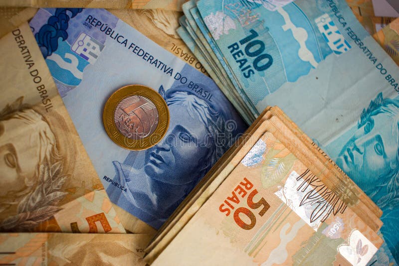 Real Notes and coins, the official currency of Brazil. Real Notes and coins, the official currency of Brazil