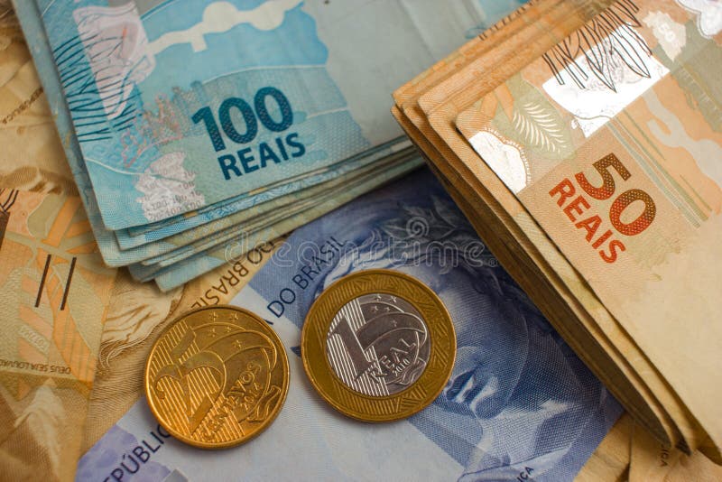 Real Notes and coins, the official currency of Brazil. Real Notes and coins, the official currency of Brazil