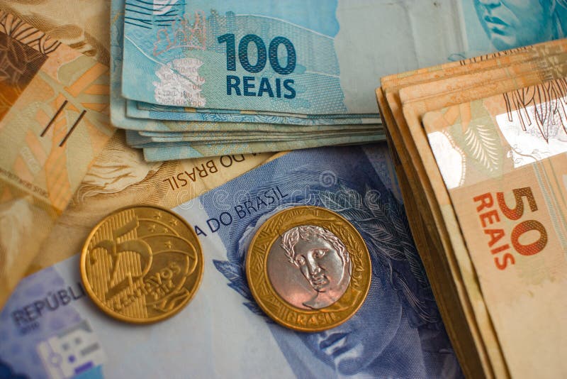 Real Notes and coins, the official currency of Brazil. Real Notes and coins, the official currency of Brazil