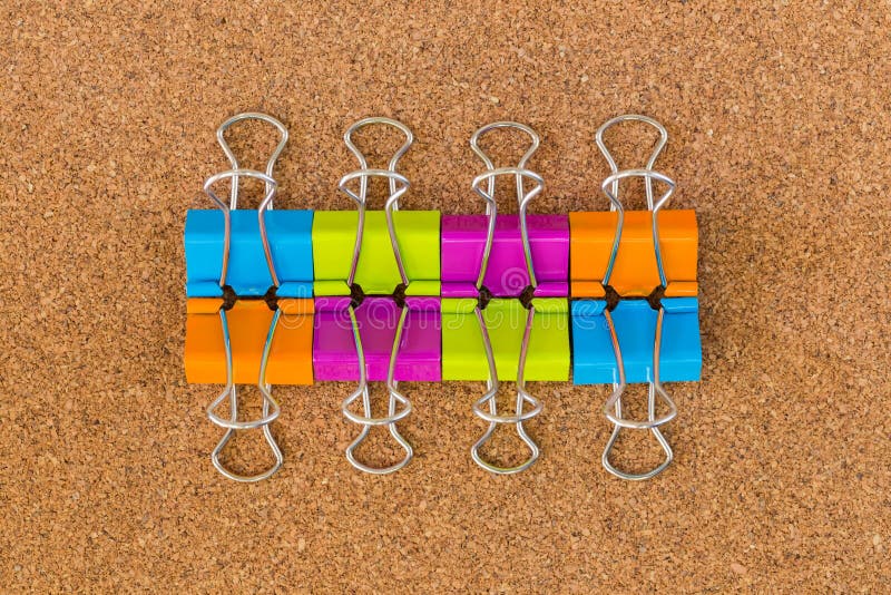 Binder clips on cork board stock image. Image of clip 93950213
