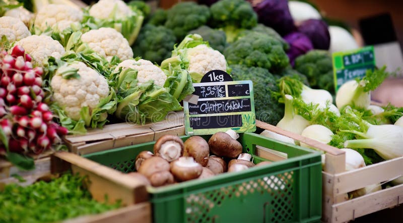 Fresh bio mushrooms and various vegetables on farmer market in Strasbourg, France. Typical European local farmer market. Fresh bio mushrooms and various vegetables on farmer market in Strasbourg, France. Typical European local farmer market