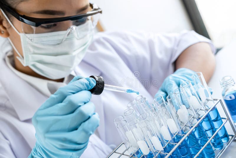 Biochemistry Laboratory Research Chemist Is Analyzing Sample In Laboratory With Equipment And