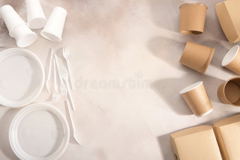 Biodegradable and plastic tableware on light background. Secondary processing. The concept of zero waste.