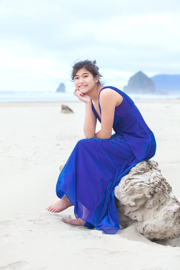 Biracial Teen Girl In Blue Dress Sitting On Beach Stock Image Image Of Biracial Relaxed 95316467 