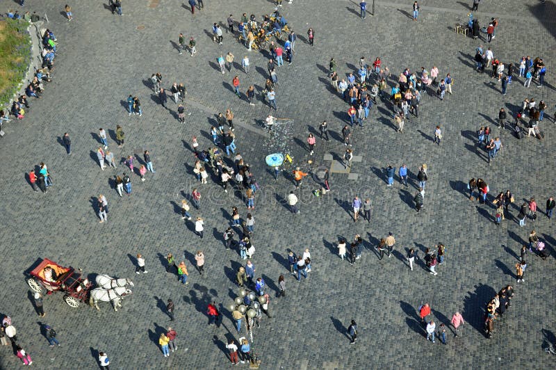 Bird`s eye view of Prague sightseers in the old town square