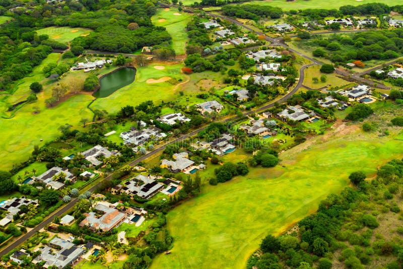 A bird`s-eye view of the town and Golf courses on the island of Mauritius.Villas on the island of Mauritius.Golf course.