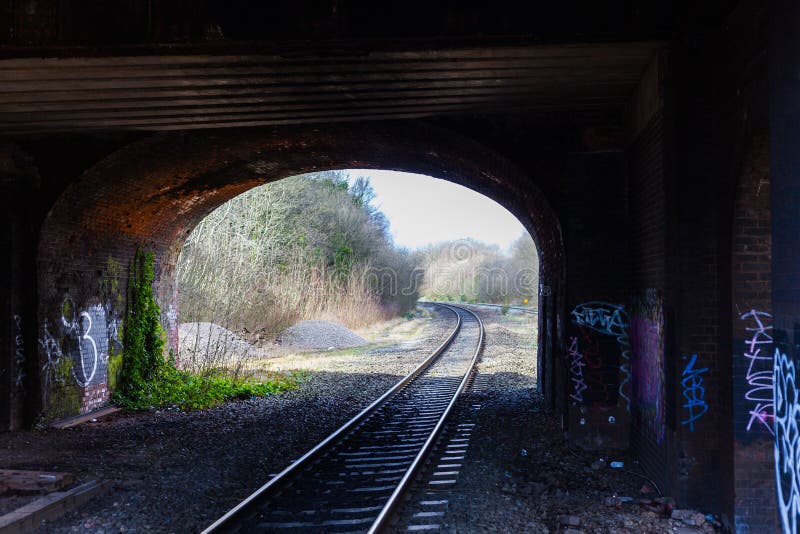 BIRMINGHAM, UK - March 2018 Underground. Gravel and Dry Twigs Around the Area. Vandalism on the Dirty Bricked Wall