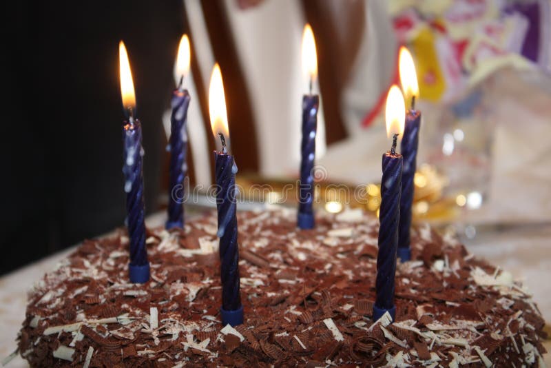 Birthday cake. Delicious chocolate birthday cake with six lit candles stock photos Birthday cake. Delicious chocolate birthday cake with six lit candles stock photos
