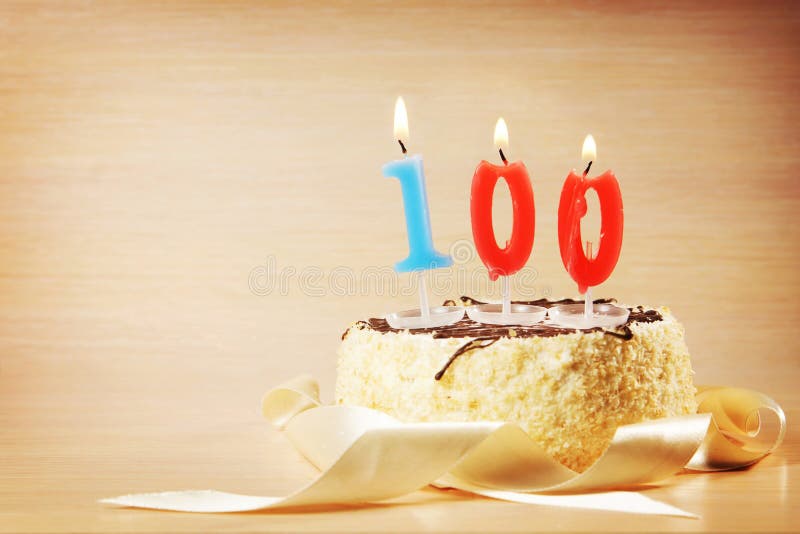 Birthday Cake with Burning Candle As a Number One Hundred Stock Photo