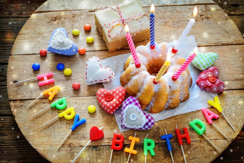 Birthday cake with burning candles stock photo Birthday cake with burning candles stock photo