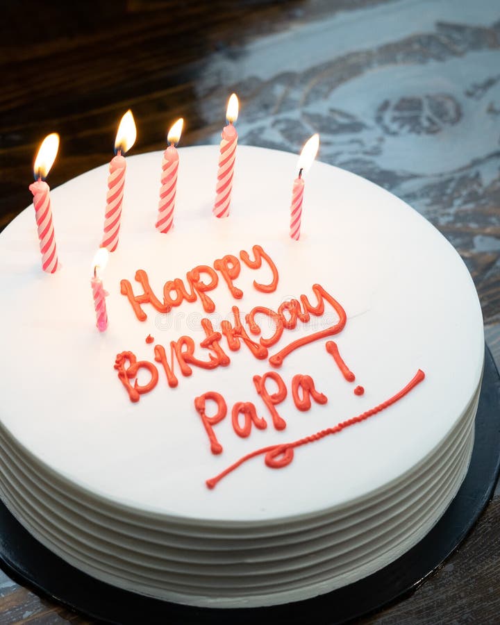 Birthday Cake for Dad Written `Happy Birthday Papa` on the Table