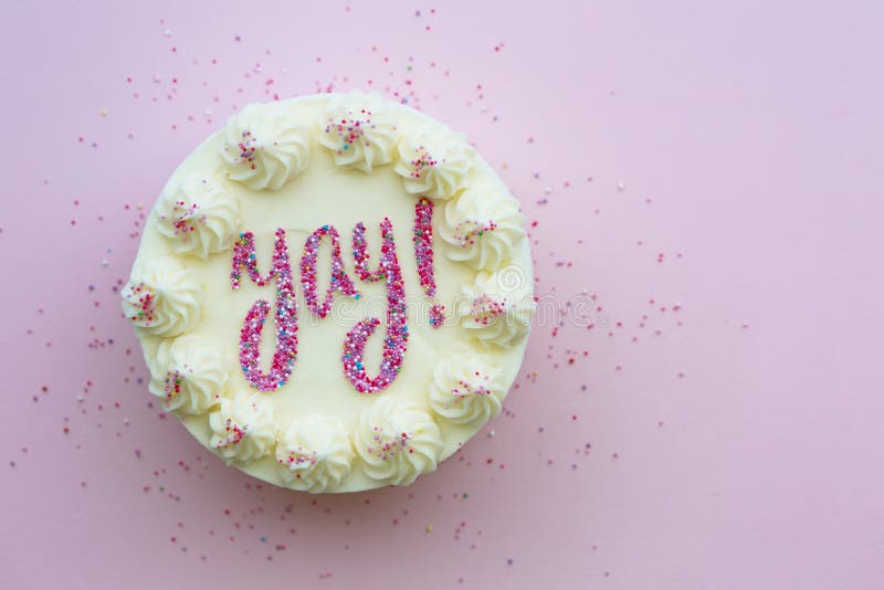 Birthday cake with yay written in sprinkles