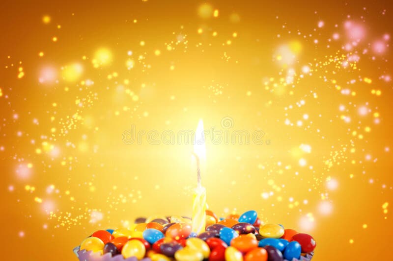 Birthday candle on Delicious cupcake with candies stock photo Birthday candle on Delicious cupcake with candies stock photo