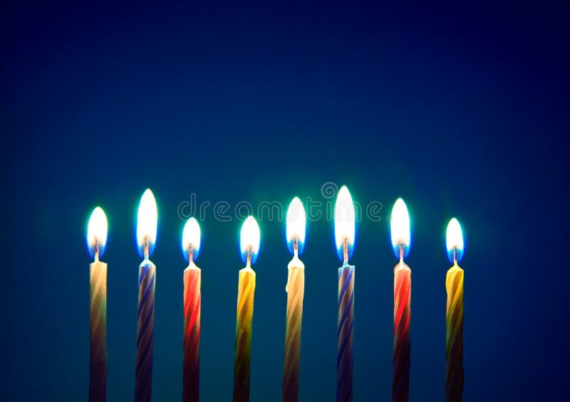 Birthday candles over blue background