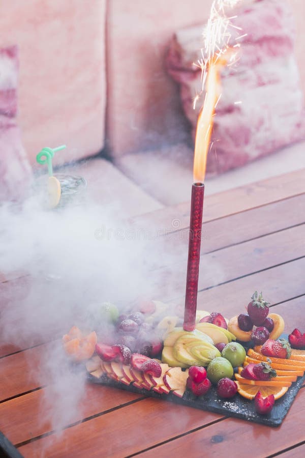 Birthday Celebration Firework Candle Set Inside of an Exotic Fruit