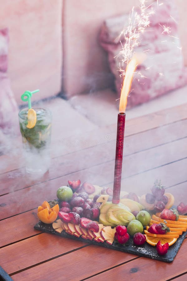 Birthday Celebration Firework Candle Set Inside of an Exotic Fruit