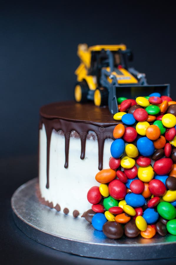 Birthday Chocolate Cake with Tractor and Candy on Top. Stock Image