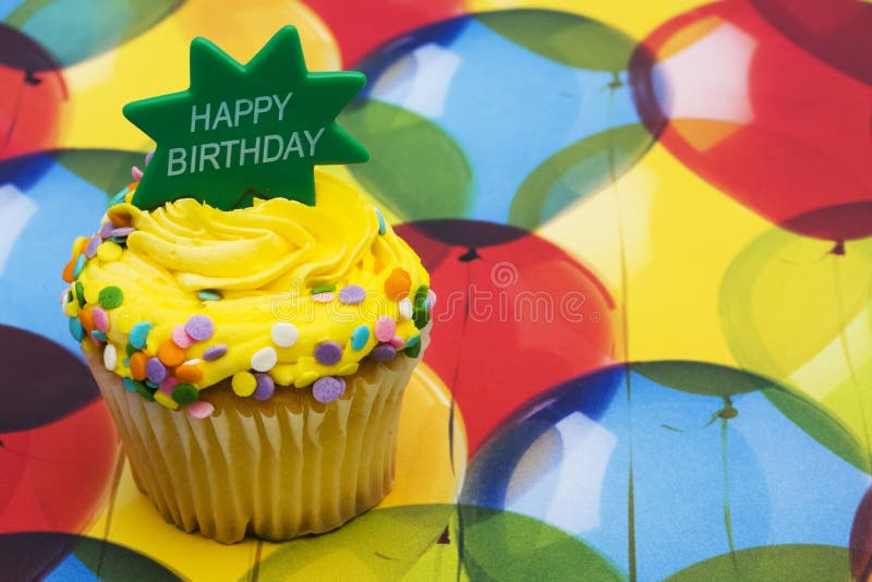 Birthday Cupcake. With a balloon background ? celebration time royalty free stock photography Birthday Cupcake. With a balloon background ? celebration time royalty free stock photography