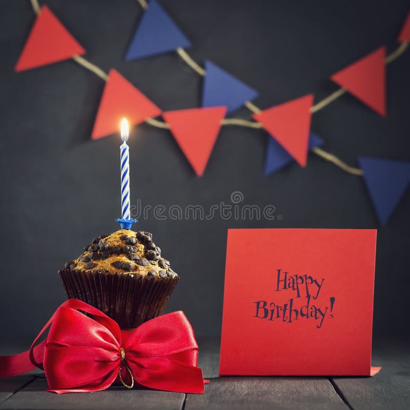 Birthday cupcake on a dark background. Happy Birthday. Postcard. Congratulations. stock photos Birthday cupcake on a dark background. Happy Birthday. Postcard. Congratulations. stock photos