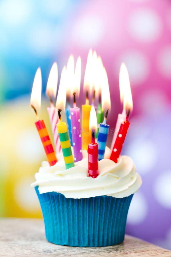 Birthday cupcake. Cupcake decorated with colorful birthday candles stock photography Birthday cupcake. Cupcake decorated with colorful birthday candles stock photography