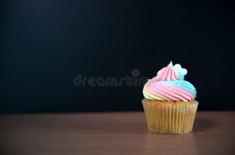 Birthday cupcake in front of a chalkboard.mini cake royalty free stock images Birthday cupcake in front of a chalkboard.mini cake royalty free stock images