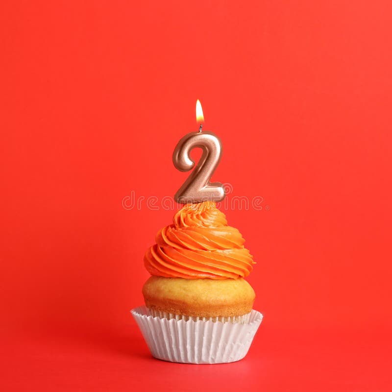 Birthday Cupcake With Number Two Candle On Red Stock Photo - Image of ...