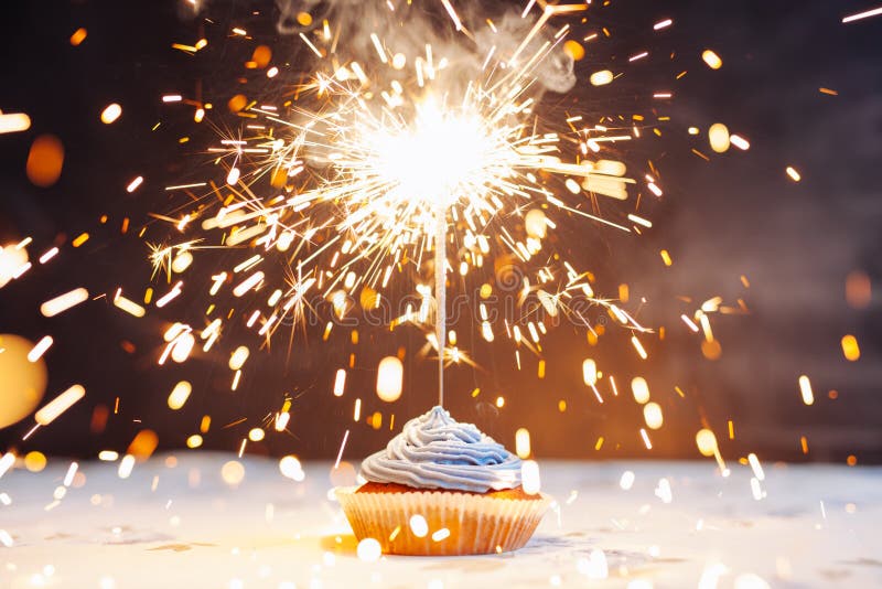 Birthday Cupcake with a Sparkler Stock Photo Image of icing, magic