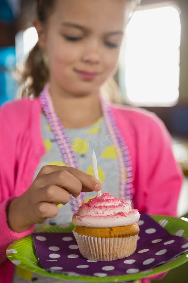 Birthday Girl Holding a Cupcake Stock Photo Image of birthday, female 97373798