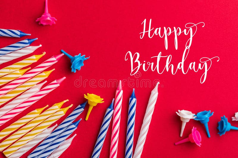 Birthday greeting card. With very colorful candles red, yellow, white and blue on a red background. royalty free stock images Birthday greeting card. With very colorful candles red, yellow, white and blue on a red background. royalty free stock images