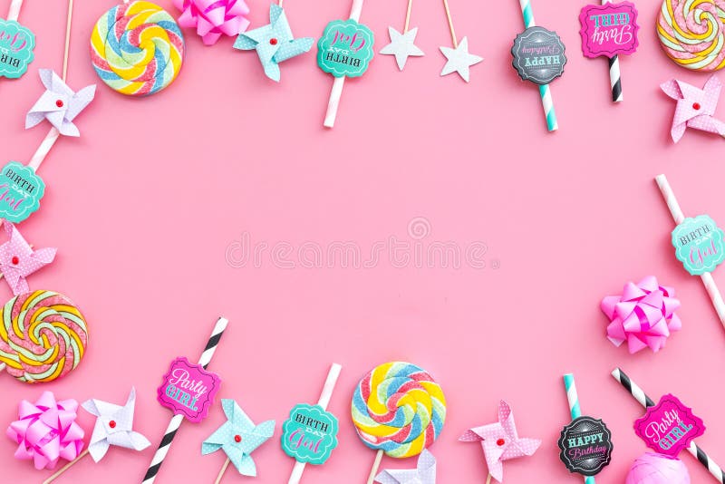 Birthday party background. Lollipop and decoration on pink top view mockup