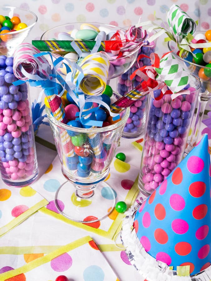 A buffet table full of colorful sweet and tasty candy. A buffet table full of colorful sweet and tasty candy.