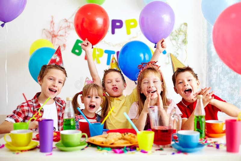 Group of adorable kids having fun at birthday party