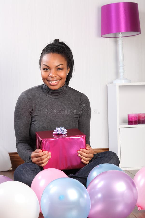 Birthday party at home with present and balloons