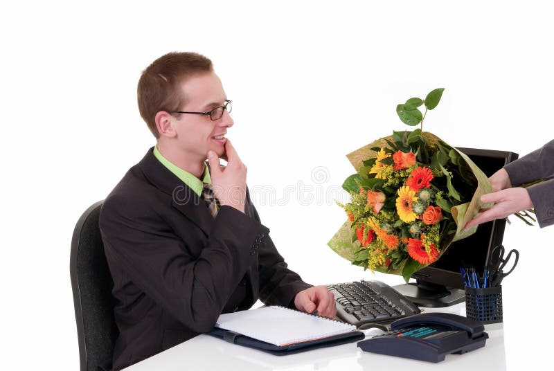 Birthday, promotion flowers. Handsome young successful businessman getting flowers for birthday, promotion, white background, studio shot royalty free stock photos Birthday, promotion flowers. Handsome young successful businessman getting flowers for birthday, promotion, white background, studio shot royalty free stock photos