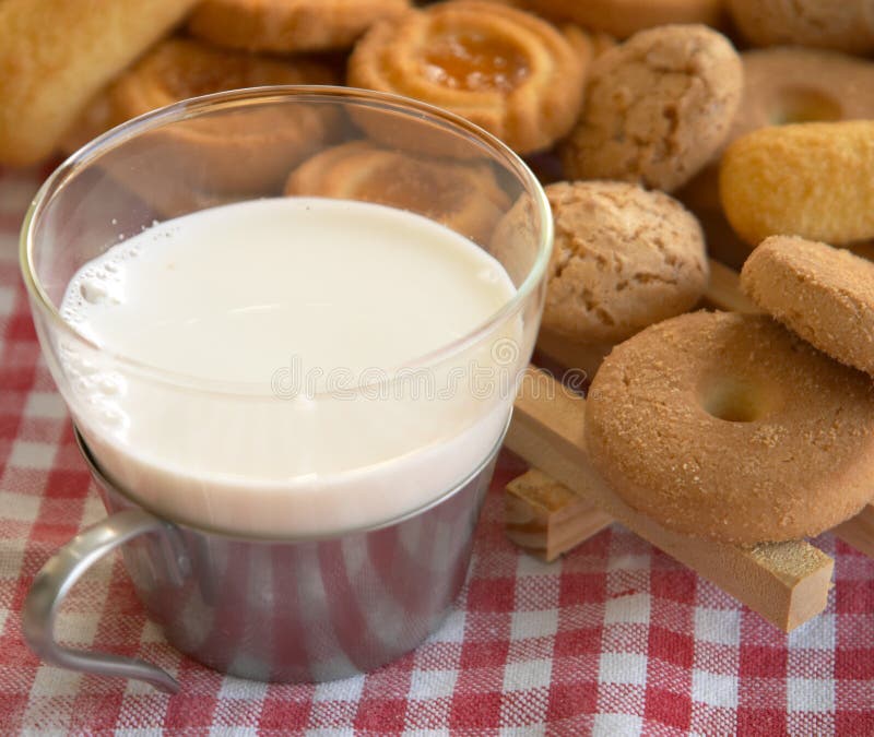 Cereal biscuits and a cup of milk: Italian style breakfast. Cereal biscuits and a cup of milk: Italian style breakfast