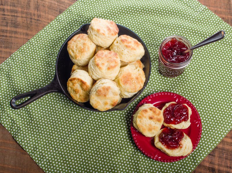 Cast iron skillet of fresh biscuits or scones with jam or jelly. Cast iron skillet of fresh biscuits or scones with jam or jelly
