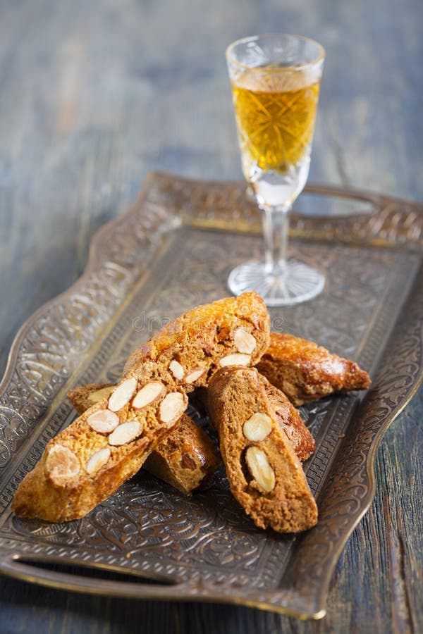 Biscotti and a Glass of Liquor. Stock Photo Image of tasty, golden