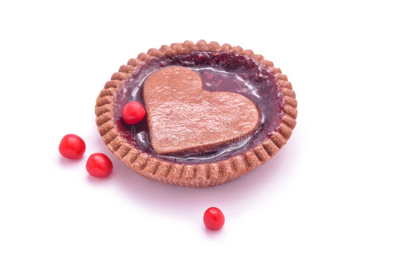 Heart shaped jam cookie pie and berries isolated. Heart shaped jam cookie pie and berries isolated
