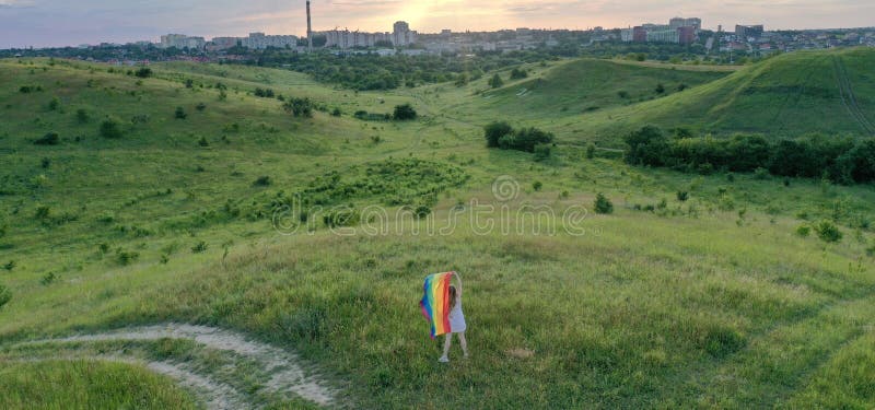 Homosexual Woman with LGBT Flag on Green Field Stock Image - Image of