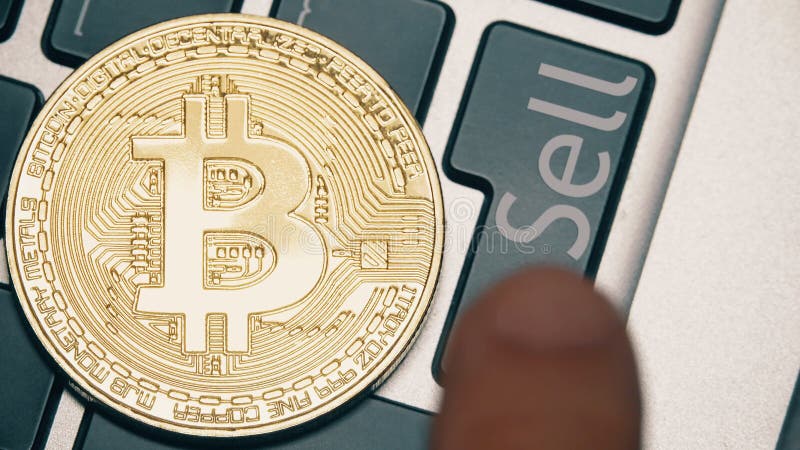 Shiny bitcoin on the laptop keyboard. Keyboard sell stock images, royalty-free photos and pictures