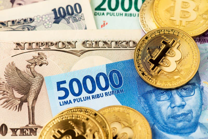 Bitcoin cryptocurrency coins on Japanese Yen and Indonesia Rupiah.