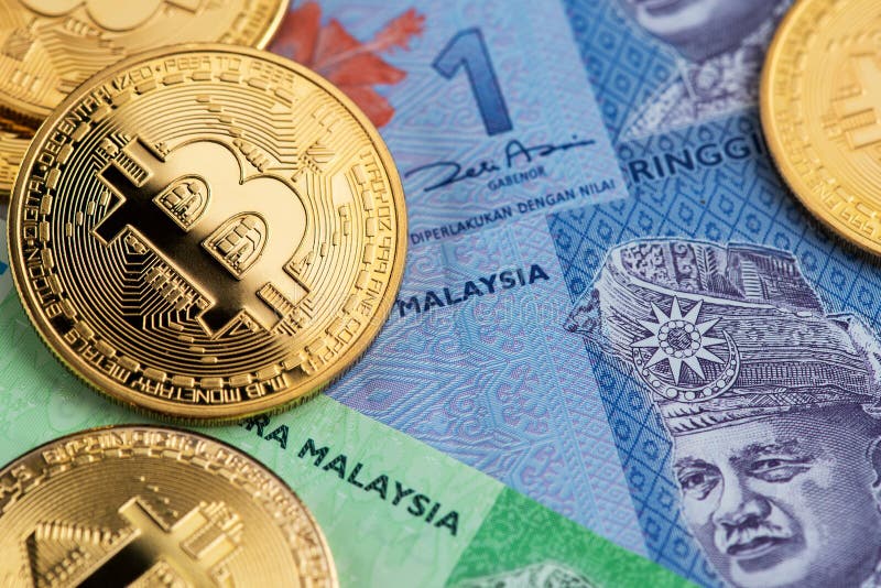 Bitcoin Cryptocurrency mynt på sedlar för Malaysia Ringgitvaluta royaltyfri fotografi Bitcoin Cryptocurrency mynt på sedlar för Malaysia Ringgitvaluta royaltyfri fotografi