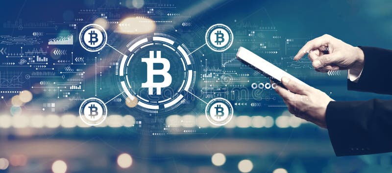 Bitcoin theme with businessman using a tablet royalty free stock photography