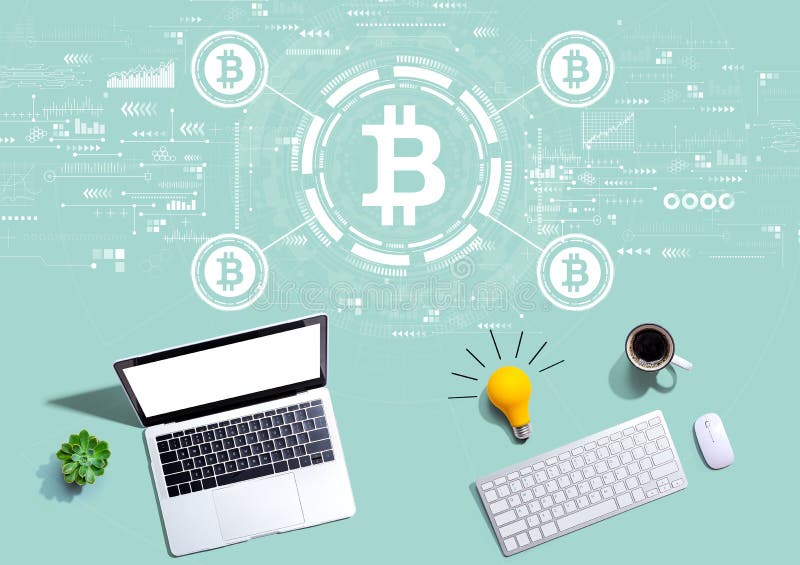 Bitcoin theme with computers with a light bulb stock photo